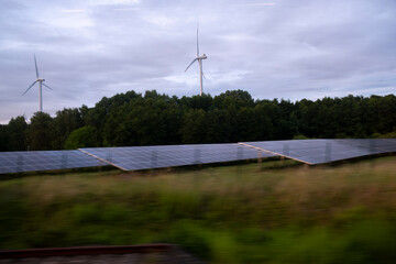 Renewable solar panels and wind turbines near Berlin illustrating clean energy production combining natural landscape and technological innovation for sustainable environment