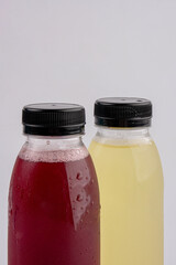 Fruit juice in a clear bottle on a white background