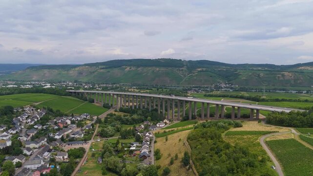 Moselle Viaduct Longuich, vineyard in Mosel valley, bridge of highway crossing river near Trier, german autobahn, aerial view