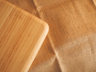 Wooden tray on burlap table for simple minimalist style background.