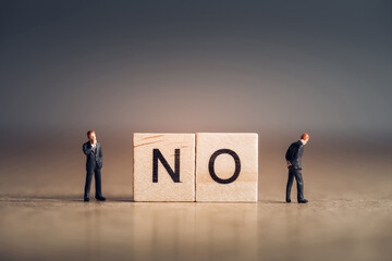 Wooden tiles with letters spelling out the word No. Business concept