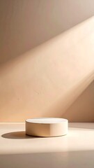 Beige Cylindrical Display Platform in Sunlit Room