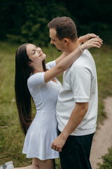 Obraz premium Young couple walking at nature at summer 