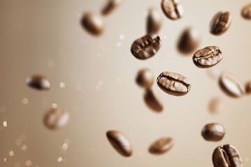 Floating coffee beans in motion against blurred neutral background