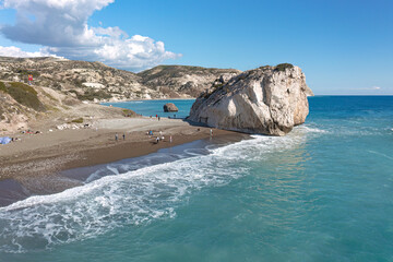Tourists enjoying beach and Aphrodite's rock (Petra tou Romiou) in Cyprus