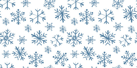 Winter vector seamless pattern with snowflakes in doodle style. Snowy background in Scandinavian style for textile, fabric, print, package, wallpaper, wrapping paper. Christmas simple art