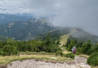 Obraz premium On hike from Gemeindealpe 1626 m summit down to Erlaufsee lake at 827 m, Lower Austria Limestone Alps in Mitterbach am Erlaufsee municipality, Styria, Austria