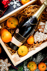 New Year's champagne and tangerines in box top view
