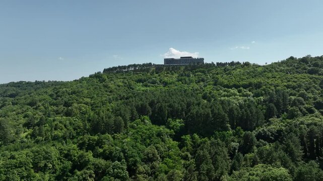 Sighnaghi, Georgia - July 15 2025: Aerial view of modern hilltop hotel Bodbe. Complex with Pool Terrace Overlooking Lush Green Valleys and Distant Horizon over Sighnaghi city