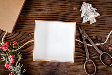 packaging christmas gifts in boxes on wooden background top view