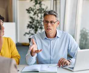 Portrait of a group of business people having a meeting in the office. Teamwork and success...