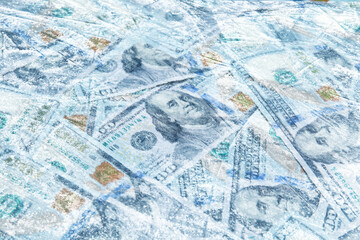 Money under ice. Many dollar bills frozen