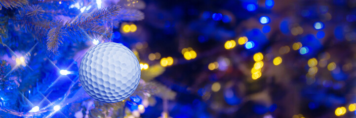 Golf ball hanging on a Christmas tree, gift for a golfer, Golf club Christmas celebration, holiday...