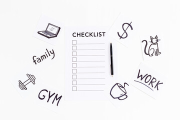 Checklist and many paper cards with hand drawing of different life activities, top view. Life balance and planning concept.