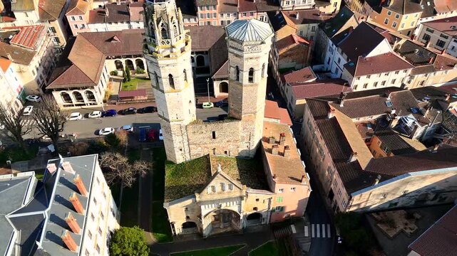 Drone view of twin tower cathedral and Saone River bridge in Macon France
