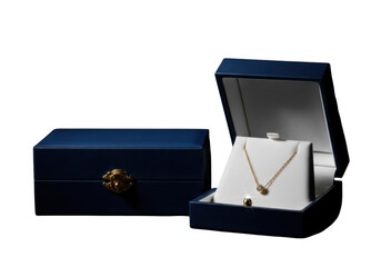 Elegant gold necklace with a green gemstone in a blue jewelry box isolated on transparent background
