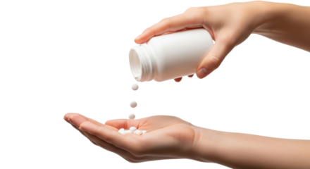 Hands pouring pills from white bottle into palm on isolated background