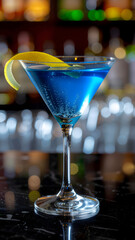 Martini glass with colorful cocktail in a bar