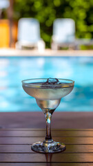 Summer cocktails on beach pool and table