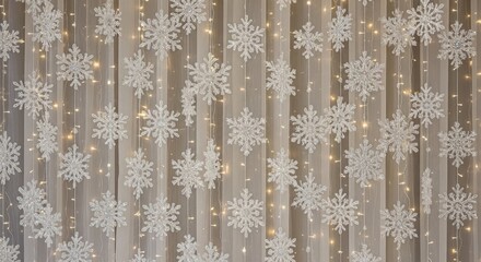 White snowflakes hanging on a sheer curtain with fairy lights