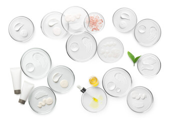 Petri dishes with cosmetic products on white background, top view