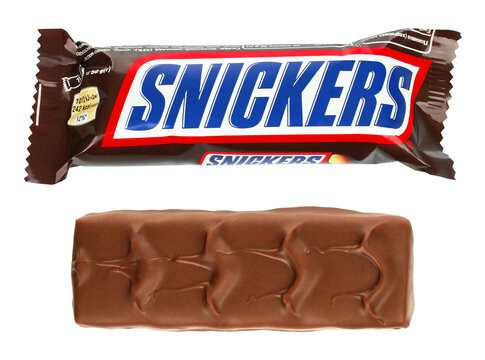 Set of Snickers chocolate bar in wrapper and unwrapped, isolated on transparent background