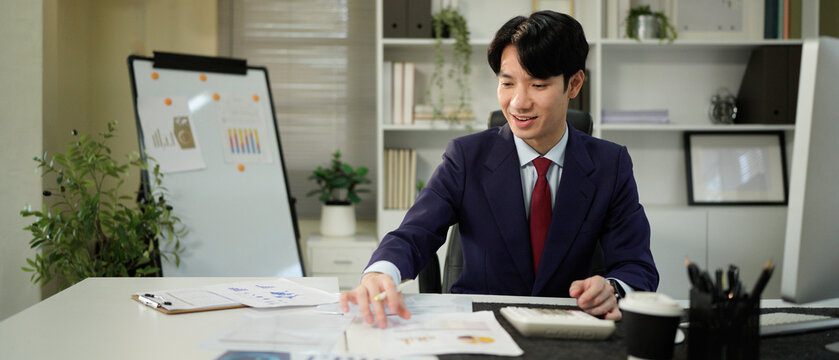 businessman hand working with finances about cost and calculator and computer on desk in modern office - Powered by Adobe
