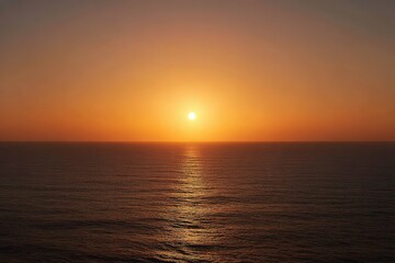 Naklejka premium Orange Sunset over the Ocean with Golden Light Reflections on Water Surface