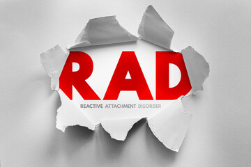 Torn paper design revealing the acronym RAD, symbolizing Reactive Attachment Disorder. Conceptual visual about childhood trauma, emotional detachment, and psychological health awareness
