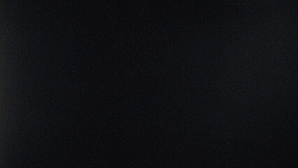 Minimalist dark black textured background with subtle fine grain, a sleek monochrome backdrop. Ideal for overlays, product photography, modern design, cinematic effects, and abstract projects.