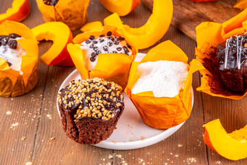 Tasty autumn chocolate pumpkin cupcakes, glazed muffins