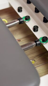 Pilates, machine and hands of person with springs for adjustment for exercise, workout and fitness. Health club, closeup and woman with reformer equipment for practice for wellness, mobility or hobby