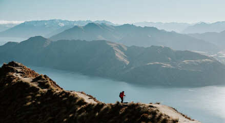 Hiker Walking on Roys Peak Track Overlooking Lake Wanaka, New Zealand