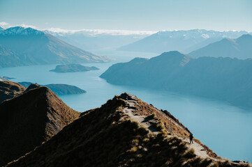 Hiker Walking on Roys Peak Track Overlooking Lake Wanaka, New Zealand