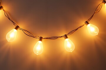String of warm glowing light bulbs creating a cozy and festive ambiance