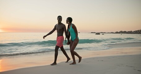 Fototapeta premium Happy, black couple and laugh for walk on beach of summer vacation, tropical journey and romantic date. Smile, people and holding hands for ocean travel, commitment and funny joke for getaway holiday