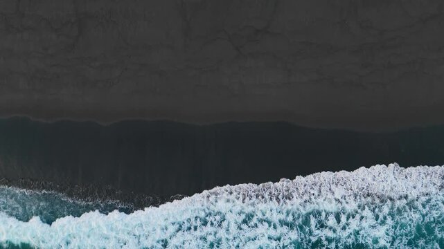 Aerial view of black sand volcanic beach with crashing waves,Abstract pattern in nature, Surreal nature drawing, Serene and tranquil landscape