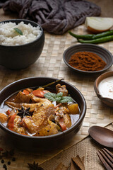 Savor authentic chicken curry with potatoes, a flavorful journey. Served with rice, enjoy a delicious, traditional Indian culinary experience that excites the senses. Ready to eat!