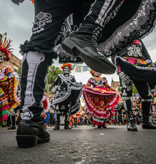 Street parade on Day of the Dead, Mexico. Creative super low angle shot.