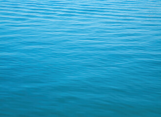 Calm river surface reflecting light in peaceful, serene natural setting