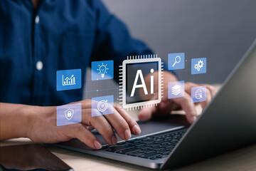 Businessman's hands typing on laptop with AI icon and technology interface. Concept of artificial intelligence, big data, digital transformation and innovation in business and technology