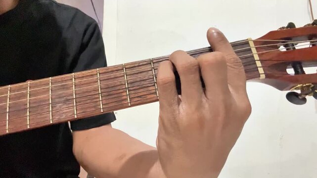 playing several guitar chords, there are basic chords and hanging chords