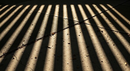Rhythmic interplay of light and shadow casting linear patterns below