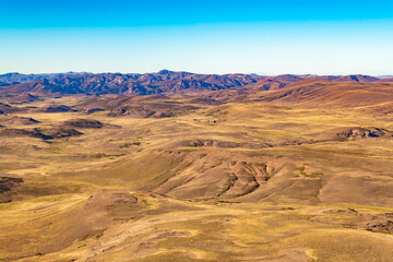 Naklejka premium The rugged beauty of the pampa in the Argentinean Patagonia near San Carlos de Bariloche with its dry terrain and sparse vegetation.