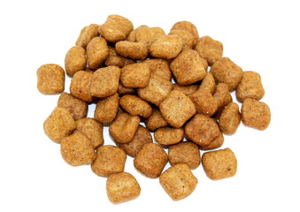 Dry balanced food for cats and dogs in the form of square granules on a white background. Top view.
