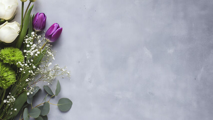 Elegant spring bouquet of white roses purple tulips and green chrysanthemums on a textured gray background