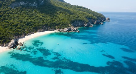 Aerial view of tropical bay with turquoise water and lush green island