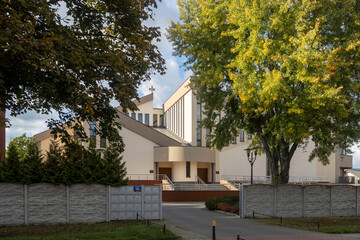Fototapeta premium Warsaw, Poland, 3 October 2025, The image depicts the Roman Catholic Church of St. Ignatius Loyola, situated within the Wawrzyszew Cemetery in Warsaw.