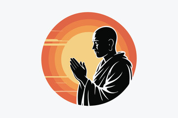 Silhouette of a monk in prayer with a rising sun behind him