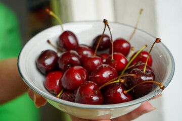 A bowl full of vibrant red cherries, perfect for a healthy snack